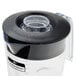 A clear plastic Hamilton Beach blender jar with a black lid.