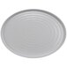 A white oval platter with a circular pattern on the surface.