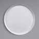 A GET Diamond White raised rim melamine plate on a gray surface.