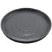 A round gray plate with a textured surface.