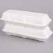 Two white Genpak styrofoam containers with hinged lids.