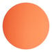 A close up of a round orange table top.