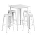 A Lancaster Table & Seating pearl white square bar height table with white stools.