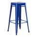 A blue metal Lancaster Table & Seating barstool with a metal seat.