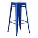 A blue metal Lancaster Table & Seating barstool with no back on a metal seat.