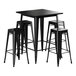 A Lancaster Table & Seating Onyx Black Bar Height Outdoor Table with 4 black backless barstools.