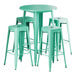 A Lancaster Table & Seating bar height table with aquamarine top and four backless barstools.