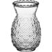 A clear Acopa glass with a pineapple pattern.