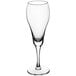 An Acopa Select clear tulip flute glass.