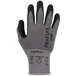 A close-up of a medium-sized Ergodyne ProFlex warehouse glove with gray and black trim.