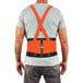 A man wearing an Ergodyne ProFlex hi-vis back support brace over a shirt.