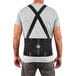 A man wearing an Ergodyne ProFlex back support brace with a black spandex back support.