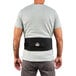 The back of a man wearing a black Ergodyne ProFlex 1505 back support belt.