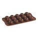 A brown silicone chocolate mold with 15 round compartments.