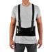 A man wearing an Ergodyne ProFlex back brace with suspenders.