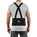 A man wearing an Ergodyne ProFlex back support belt with black elastic straps.