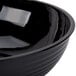 A black Cambro round ribbed bowl.