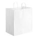 A white paper shopping bag with handles.