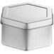 A 2 15/16" x 1 9/16" silver metal container with a hexagon lid.