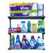 A Triton wall mount shelf with cleaning products on it, including blue bottles and containers with red caps.