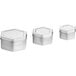 A group of 3 silver hexagon-shaped metal tins with slip covers.