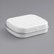 A white rectangular tin with a hinged lid.