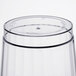 A close-up of a WNA Comet clear plastic fluted tumbler.