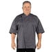 A man wearing a slate gray Uncommon Chef short sleeve chef coat.