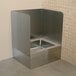 An Advance Tabco stainless steel mop sink with three sides.