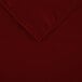 A folded burgundy rectangular Intedge cloth table cover.