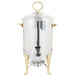 A Vollrath stainless steel coffee urn with brass trim.