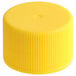 A 24/410 yellow plastic bottle cap with ribbed sides.