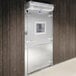 A Bally walk-in freezer metal door with a window.