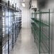 A Bally walk-in freezer with shelves in a room.