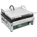A Waring commercial Panini grill with a lid and handle.