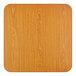 A square, oak-colored laminated tabletop with rounded corners.