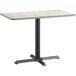 A Lancaster Table & Seating rectangular table with a white surface and black base.