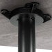 A black metal pole and base for a Lancaster Table & Seating table.