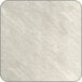 A close-up of a white surface on a square table top.