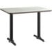 A white rectangular Lancaster Table & Seating table top on a white Lancaster Table & Seating base.