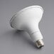 A white TCP PRO flood LED light bulb on a gray background.