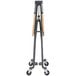 A black metal stand with wheels for a Cosco SmartFold utility table.