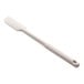An OXO Good Grips beige silicone jar spatula with a white handle.