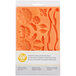 A Wilton silicone mold with a floral design.