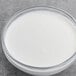 A white bowl of Les Vergers Boiron coconut cream puree.