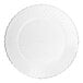 A clear plastic plate with a scalloped edge.