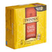 A yellow Twinings box of Earl Grey tea bags with red text.