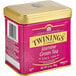 A pink and gold Twinings tin of Jasmine Green loose leaf tea.