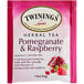 A pink and white box of Twinings Pomegranate & Raspberry Herbal Tea Bags.