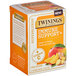 A box of Twinings Immune Support tea bags with mango and ginger on a table.